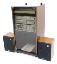 An Akai music system, comprising stereo cassette deck, CS-M3, stereo integrated amplifier AM-U11, FM