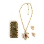 A 1950s costume jewellery set, comprising abstract necklace and matching earrings, set with white an
