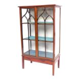 An Edwardian mahogany boxwood inlaid display cabinet, with astragal glazed doors, on tapered legs wi