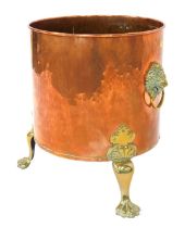 A Victorian copper and brass log bucket, cylindrical hammered form, with lion mask ring handles, rai