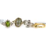 Four dress rings, comprising two silver gilt examples, each stone set, white metal stamped 925, with