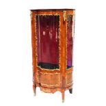 A Louis XV style kingwood vitrine, with brass mounts, of serpentine form, with a glazed door and sli