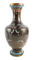 A Japanese cloisonne vase, decorated with flowers, scrolls, etc, against a black ground, with wire w