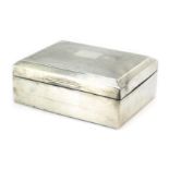 A George VI silver cigarette box, of rectangular form, the hinged lid with engine turned decoration,