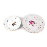 Two Meissen porcelain plates, painted centrally with flowers amongst beetles, printed marks, 24cm di
