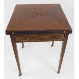 An Edwardian mahogany card table, with boxwood inlaid border, and green baize lined interior on tape