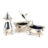 An Elizabeth II silver three piece cruet, comprising pepper pot, open salt, and lidded mustard pot,