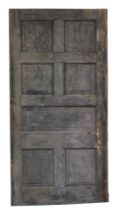 A pine stained hall door, from Ketton Hall, Nr Stamford, with three sectional wood design, with appl