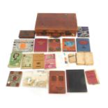 A 20thC leather case, containing a quantity of GB and World stamps, loose and in albums, to include