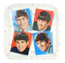 The Beatles tin tray by Worcester Ware, depicting a photographic print of the members, against a whi