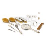 A George VI silver mounted harlequin dressing table set, comprising hand mirror, two hair brushes, t