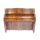 An early 20thC Bentley walnut cased upright overstrung piano, iron framed, 138cm wide.