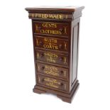A mahogany chest of five drawers, converted to an advertising cabinet for Fred Wade Gent's Clothers,