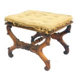 A Victorian walnut stool, the square top in need of re-upholstery, on a floral and scrolled x frame