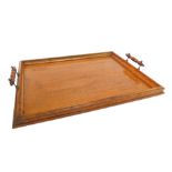 A 20thC oak two handled tray, with a gallery surround, 53cm wide.
