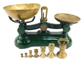A set of green cast metal and brass scales, 20cm high, with various brass weights.