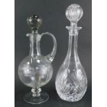 A cut glass decanter, cylindrical form with elongated neck, 35cm high, together with a glass claret