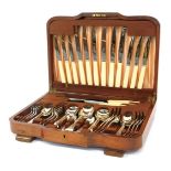 A Waring and Gillow canteen of cutlery, for six place settings, contained in an oak case, 44cm wide.