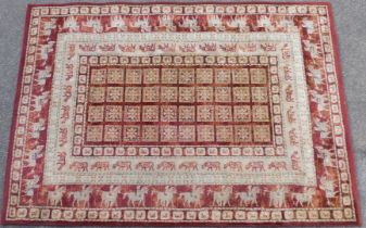 A Master Craft Noble Art Belgian machine woven rug, on a red ground, 160cm x 230cm.