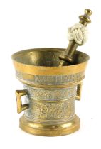 A cast brass pestle and mortar, the mortar decorated with a band of typography for Richard Startyn 1