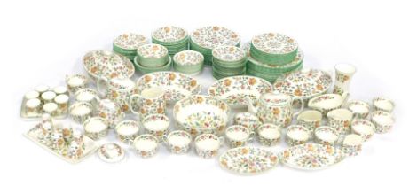 An extensive Minton tea and dinner service decorated in the Haddon Hall pattern, comprising twelve d