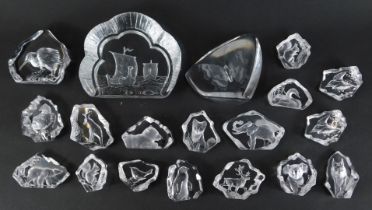 A group of Mats Jonasson glass paperweights, varying designs, to include elephant, kiwi bird, butter