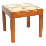 A G Plan tile top teak table, with arrangement of four mottled tiles, each with brown and orange inl