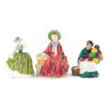 Three Royal Doulton porcelain figures, modelled as Linda HN2106, Buttercup HN3268, and The Old Ballo