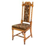 A Victorian walnut hall chair, with barley twist column supports, with tapestry seat and back.