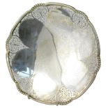 A George V silver cake stand, retailed by Finnigans of Manchester, with central petal head decoratio