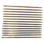 A group of brass stair rods.