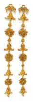 A pair of carved gilt wood pier hangings, each 124cm high.