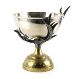 A 20thC centrepiece or wine cooler, with a rounded steel bowl supported by cast metal antlers, on a