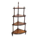 A Victorian figured walnut corner whatnot, of three tiers, with bobbin turned supports, 115cm high,