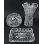 Three items of cut glassware, comprising bowl, 23cm diameter, rectangular tray, 29cm wide, and vase