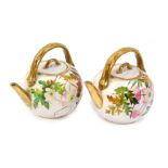 Two late 19thC French porcelain teapots, each with pink floral decoration and bamboo effect gilt han