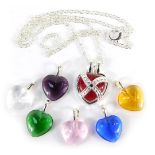 An interchangeable heart pendant, with crossover design and six additional pendant centres, in red,