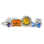 Four Gems TV dress rings, each stone set to include imitation amber, blue, purple, and orange stones