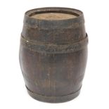 A 20thC oak barrel, with metal bound supports, 43cm high.