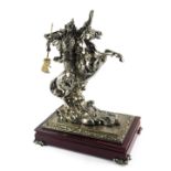 A 20thC cast metal figure group, depicting a Japanese warrior on rearing horseback, on wooden stand,