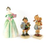 A Royal Doulton porcelain figure modelled as Happy Birthday, HN3660, together with two Goebel Hummel