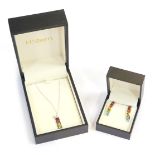 An 18ct white gold rainbow pendant and earring set, the pendant set with citrine, peridot, aquamarin