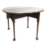 A George III mahogany circular drop leaf table, on taper turned legs and pad feet, 70cm high, 95cm w