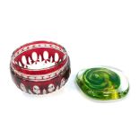 A Bohemian cranberry flash glass bowl, 9cm diameter, together with a glass paperweight, of compresse