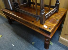 An Eastern hardwood coffee table, rectangular top, 40cm high, 115cm wide, 60cm deep.