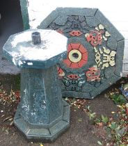 A composition painted garden table, in Oriental style, 73cm high, table top 69cm wide.