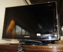 A Samsung 32" flat screen television, with remote control.