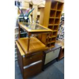 A group of furniture, to include CD rack, occasional table with glass top, two drawer filing cabinet