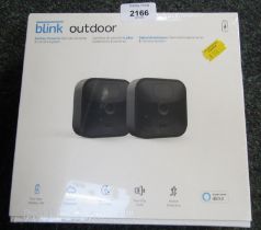 A box set of Blink outdoor battery powered security cameras.