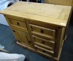 A pine side cabinet, with an arrangement of drawers and a cabinet, on plinth base, 84cm high, 92cm w